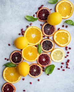 Fresh citrus slices including oranges, blood oranges and lemons.