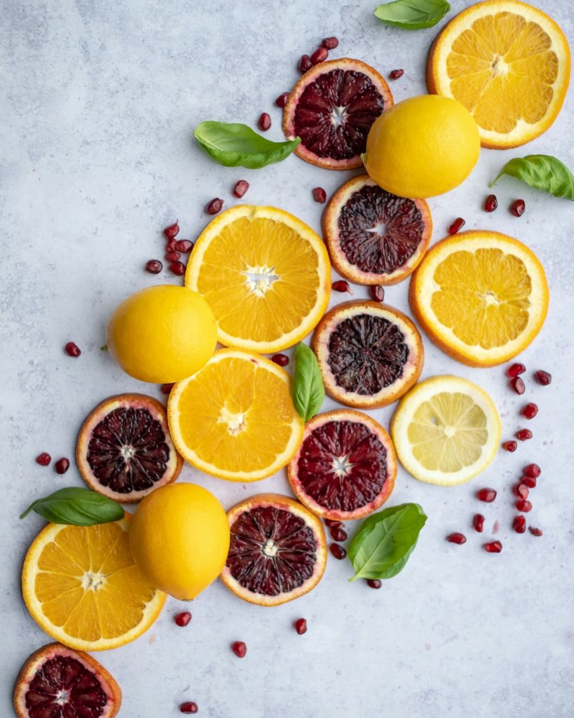 Fresh citrus slices including oranges, blood oranges and lemons.