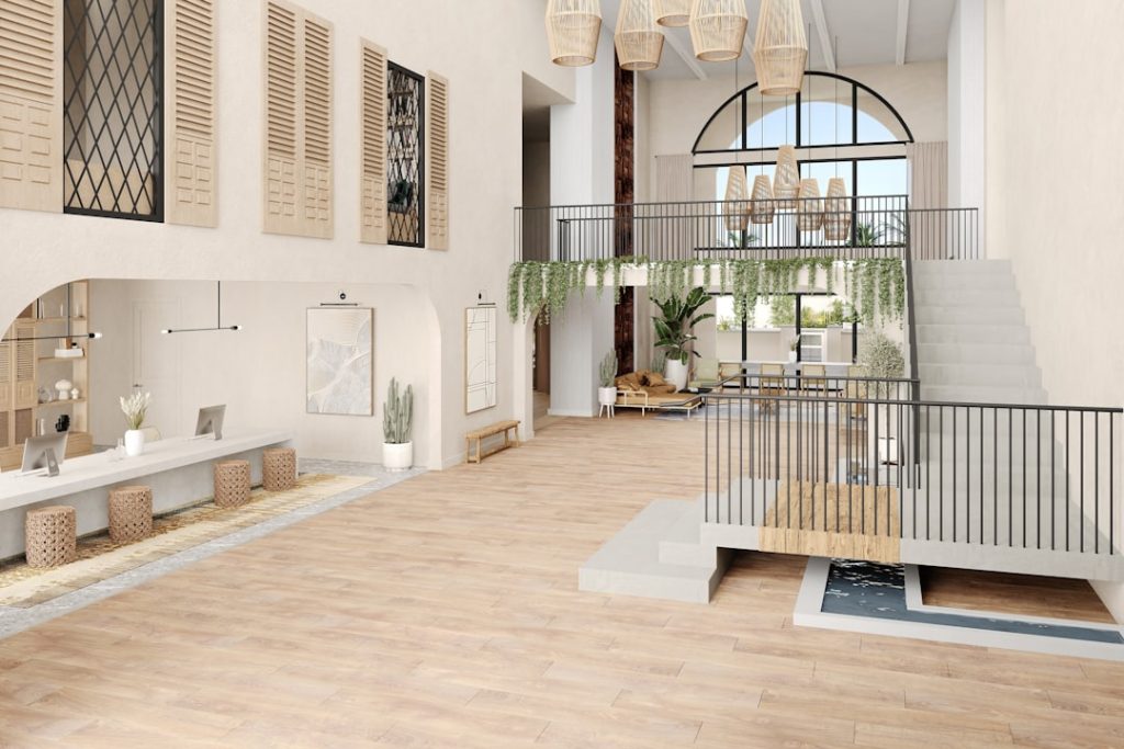 A bright Mediterranean-style interior with natural textures and a water feature.